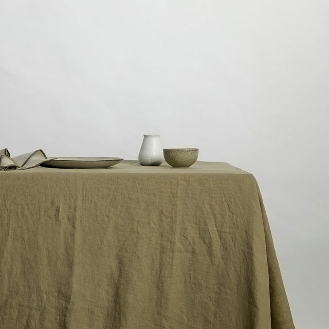 Linen tablecloth in Olive. Available in Small 150cm x 240cm & Medium 180cm x 300cm.