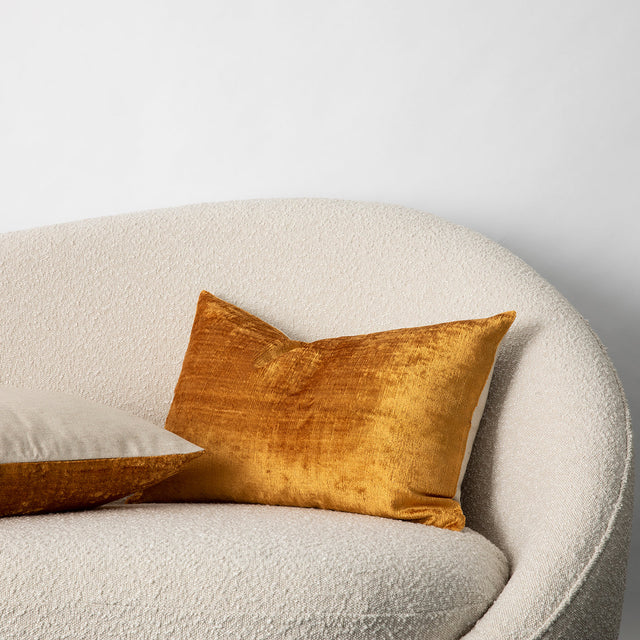 Talik Velvet Cushions in Mustard, on a boucle lounge. Size: 50 x 50cm, 60 x 40cm