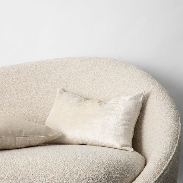 Talik Velvet Cushions in Cream on a boucle lounge. Size: 50 x 50cm, 60 x 40cm