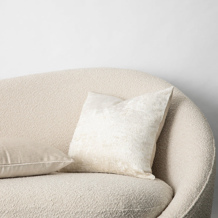 Talik Velvet Cushions in Cream on a boucle lounge. Size: 50 x 50cm, 60 x 40cm