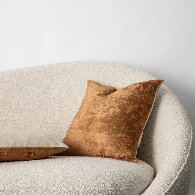 Talik Velvet Cushions in Fawn on a boucle lounge. Size: 50 x 50cm, 60 x 40cm