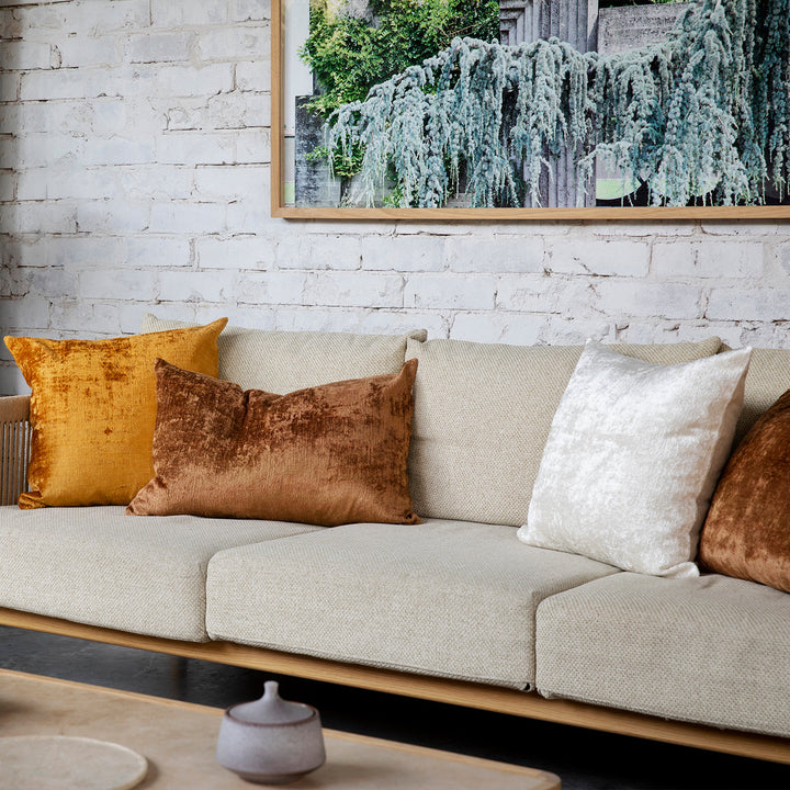 A sofa styled with Talik Velvet Cushions in Fawn, Cream and Mustard. Size: 50 x 50cm, 60 x 40cm