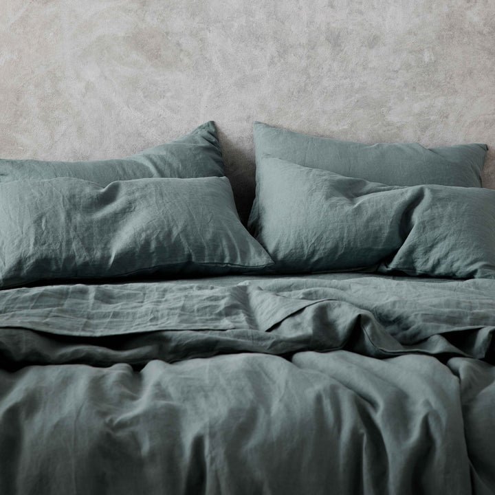 A cropped photo of a bed dressed in Bluestone bed linen. Available in Double, King, Super King.