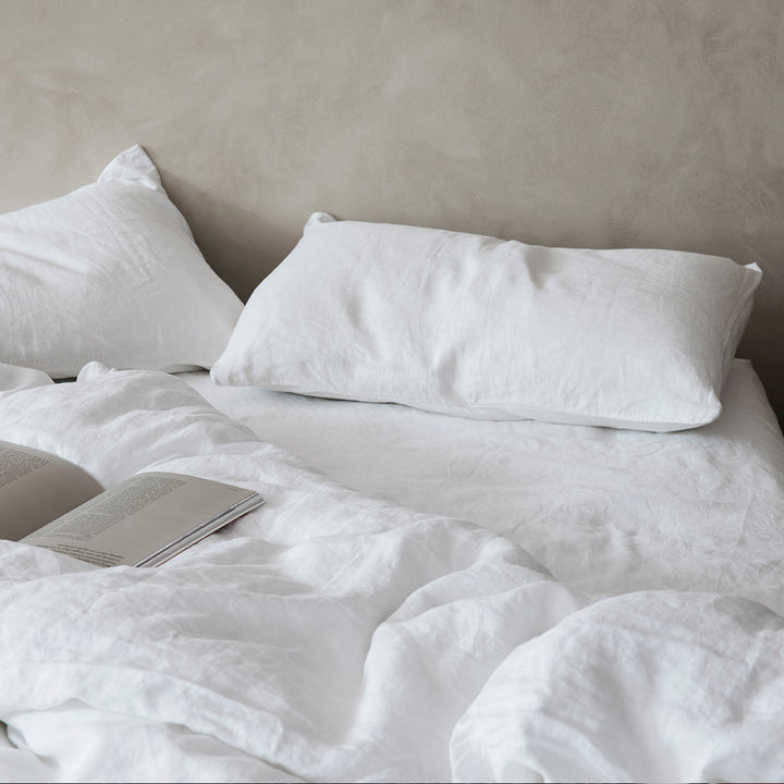 A bed dressed in White bedlinen. Available in Double, King, Super King.