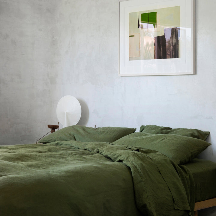 A bed dressed in Forest bed linen, styled with contemporary artwork. Available in Single, Double, King, Super King.