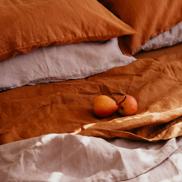 Close up of Cedar and Dusk bedlinen, styled with pears. Available in Standard & King.