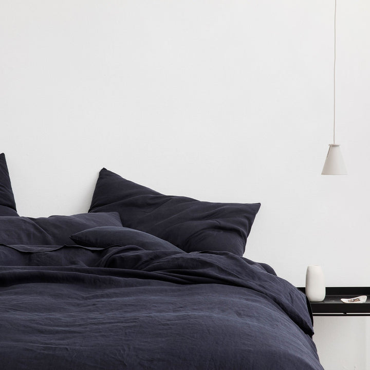 A bed dressed in Navy bed linen. Available in Double, King, Super King.