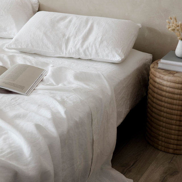 A bed dressed in a Linen Sheet Set with Pillowcases in White. Available in Single, Double, King, Super King.